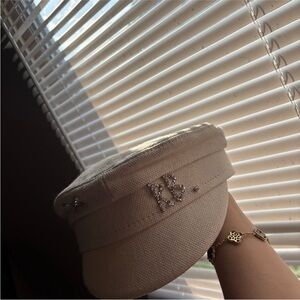 Elegant Cream Cap with Rhinestone Detailing